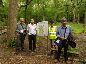 Volunteer Organiser Stuart Couper and Jon Smith, EDDC Countryside Ranger show judges the improvements to Parley Wood