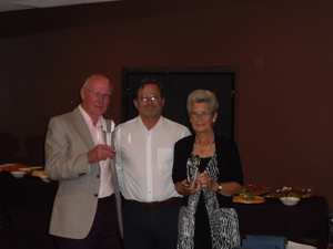 Parish Council Vice Chair Cllr Simon Jordan presents Stuart and Pat Couper with their Community Awards