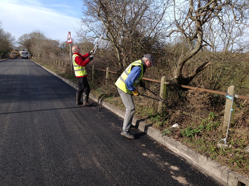 Peter Smith and Stuart Wood cutting back along New Road